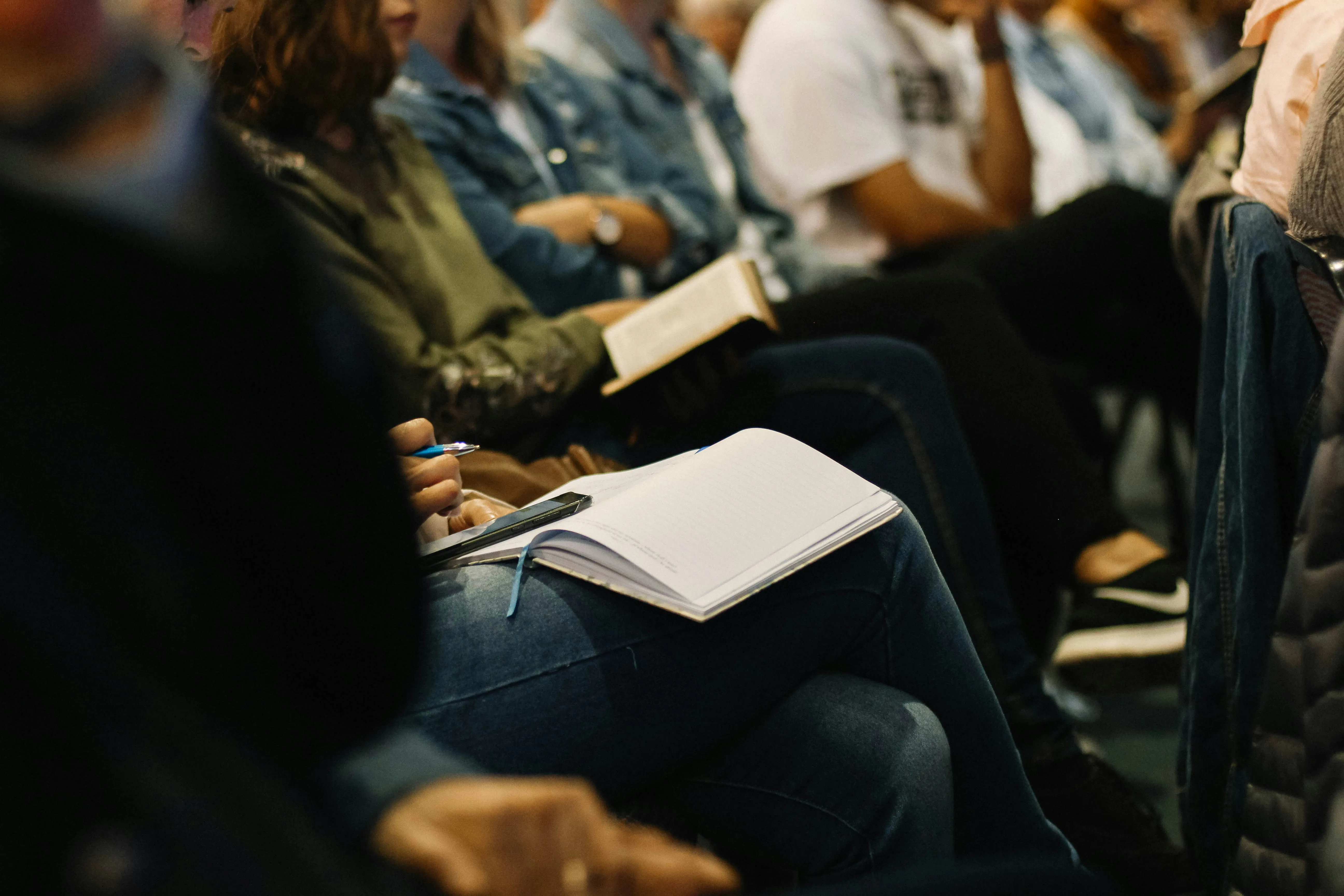 close up of people sitting in a church service